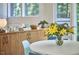 Dining area with hardwood floors, a bright white table and modern light fixture at 19 Learned Pl, Durham, NC 27705