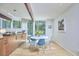 Open-concept dining area with hardwood floors, natural light, and modern furnishings at 19 Learned Pl, Durham, NC 27705
