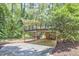 Back exterior view showing the deck above a brick lower level and carport at 19 Learned Pl, Durham, NC 27705