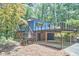 Exterior view of the home featuring a deck and the carport underneath at 19 Learned Pl, Durham, NC 27705