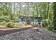 Attractive two-story home with blue siding, brick accents and large windows with a landscaped yard at 19 Learned Pl, Durham, NC 27705
