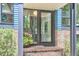Inviting front entrance with brick steps and walkway, glass front door, and stylish exterior lighting at 19 Learned Pl, Durham, NC 27705