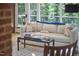 Cozy living area with natural lighting, comfortable seating, and seamless indoor-outdoor flow at 19 Learned Pl, Durham, NC 27705