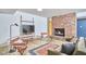 Inviting living room with brick fireplace, stylish furniture, and a cozy rug at 19 Learned Pl, Durham, NC 27705