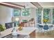 Open concept living space with bright dining and kitchen with stainless appliances and island seating at 19 Learned Pl, Durham, NC 27705