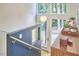 Staircase with modern railing and decorative features with large window for wooded views at 19 Learned Pl, Durham, NC 27705