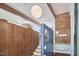 Staircase features wood and glass design with a modern chandelier and exposed wood beams at 19 Learned Pl, Durham, NC 27705