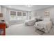 Comfortable bedroom featuring twin beds, soft lighting, and tranquil color palette at 200 Baskerville Ct, Holly Springs, NC 27540