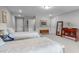 Bright bedroom featuring two beds, soft carpet, and a warm inviting atmosphere at 200 Baskerville Ct, Holly Springs, NC 27540