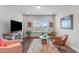 Cozy living room with a large television, comfortable seating, and stylish decor at 200 Baskerville Ct, Holly Springs, NC 27540