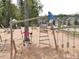 Fun playground with climbing structures and play areas, perfect for children to enjoy outdoors at 200 Baskerville Ct, Holly Springs, NC 27540