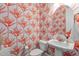 Stylish powder room featuring patterned wallpaper, a pedestal sink, and modern fixtures at 200 Baskerville Ct, Holly Springs, NC 27540