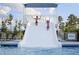 having fun on a waterslide in a pool, promising endless summer enjoyment at 200 Baskerville Ct, Holly Springs, NC 27540