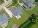 Scenic aerial view of the brick house shows its backyard and its position within a residential neighborhood at 204 Franconia Way, Apex, NC 27502