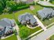 Eye-level aerial view of a single-Gathering home surrounded by lush greenery, showcasing a well-manicured landscape at 204 Franconia Way, Apex, NC 27502