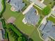 High aerial photograph of the house showcasing its backyard, position, and surrounding well-planned neighborhood at 204 Franconia Way, Apex, NC 27502