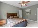 Well-lit bedroom with a decorative ceiling fan and beautiful grey walls at 204 Franconia Way, Apex, NC 27502