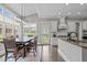 Dining room boasts ample natural light with a view of the backyard, perfect for Gathering meals and gatherings at 204 Franconia Way, Apex, NC 27502