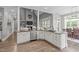 Open kitchen showcasing stainless steel appliances, a central island, and seamless integration with the living areas at 204 Franconia Way, Apex, NC 27502