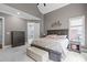 Inviting main bedroom with vaulted ceilings, carpet flooring, ensuite bathroom, and neutral paint colors at 204 Franconia Way, Apex, NC 27502