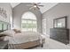 Beautiful main bedroom with vaulted ceilings, large windows, carpet flooring, and neutral paint colors at 204 Franconia Way, Apex, NC 27502