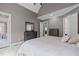 Comfortable main bedroom featuring vaulted ceilings, neutral paint colors, carpet flooring, and ensuite access at 204 Franconia Way, Apex, NC 27502