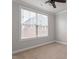 Bedroom with large window and neutral carpet at 212 Sea Trail St, Hillsborough, NC 27278