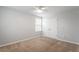 Bedroom with neutral walls, closet, ceiling fan, and natural light at 212 Sea Trail St, Hillsborough, NC 27278