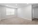 Bedroom featuring neutral-colored carpet, natural light, and neutral paint at 212 Sea Trail St, Hillsborough, NC 27278