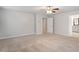 Spacious bedroom with carpeted floors leads to ensuite bath and walk-in closet at 212 Sea Trail St, Hillsborough, NC 27278