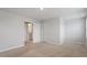 Bedroom with neutral carpet, neutral walls, en-suite, and walk-in closet at 212 Sea Trail St, Hillsborough, NC 27278