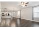 Open living area with kitchen and large windows at 212 Sea Trail St, Hillsborough, NC 27278