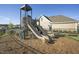 Neighborhood playground with a double slide at 212 Sea Trail St, Hillsborough, NC 27278