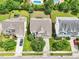 Aerial shot displaying a home with a landscaped yard and driveway nestled in a neighborhood at 214 Ashdown Forest Ln, Cary, NC 27519