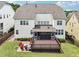 Aerial view showcasing a spacious backyard with a deck and a seating area at 214 Ashdown Forest Ln, Cary, NC 27519