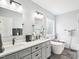 Beautiful bathroom with a double vanity, soaking tub, and elegant black bronze fixtures at 214 Ashdown Forest Ln, Cary, NC 27519