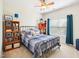 Cozy bedroom with a metal-frame bed, a ceiling fan, and blue decor at 214 Ashdown Forest Ln, Cary, NC 27519