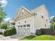 Two-story home featuring a well-manicured lawn, a two-car garage, and vinyl siding with a charming gable roof at 214 Ashdown Forest Ln, Cary, NC 27519