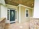 Inviting front door with decorative glass, sidelights, stone accents, and a 'Welcome' mat at 214 Ashdown Forest Ln, Cary, NC 27519