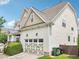 A two car garage with decorative doors in a home with neutral toned siding at 214 Ashdown Forest Ln, Cary, NC 27519