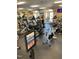 Bright and airy gym with a variety of cardio equipment, including treadmills, ellipticals, and stationary bikes at 214 Ashdown Forest Ln, Cary, NC 27519