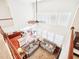 Aerial view of the living room with hardwood floors, large windows, and an open connection to the kitchen at 214 Ashdown Forest Ln, Cary, NC 27519