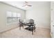 Bright office with large window, ceiling fan, neutral carpet and walls, perfect for working from home at 214 Ashdown Forest Ln, Cary, NC 27519