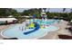 A large swimming pool area with water features and a slide perfect for Gathering fun and community enjoyment at 214 Ashdown Forest Ln, Cary, NC 27519