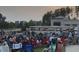 Town gathering of people sitting in lawn chairs enjoying an outdoor concert at 214 Ashdown Forest Ln, Cary, NC 27519
