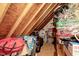An attic area for storage with wooden beams and visible insulation at 218 Kinvara Ct, Wake Forest, NC 27587