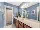 Blue bathroom featuring a granite-topped vanity, and a tub and shower combo with shower curtain at 218 Kinvara Ct, Wake Forest, NC 27587