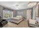 Bedroom with a ceiling fan, window, and a bed with white frame at 218 Kinvara Ct, Wake Forest, NC 27587