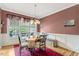 Formal dining room featuring wood floors, chandelier, and bright natural light at 218 Kinvara Ct, Wake Forest, NC 27587