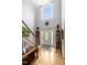 Grand foyer with hardwood floors, a staircase, and a beautiful two-story window at 218 Kinvara Ct, Wake Forest, NC 27587